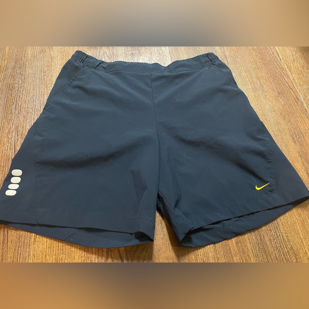 Nike Black Athletic Running Shorts with Yellow Swoosh
